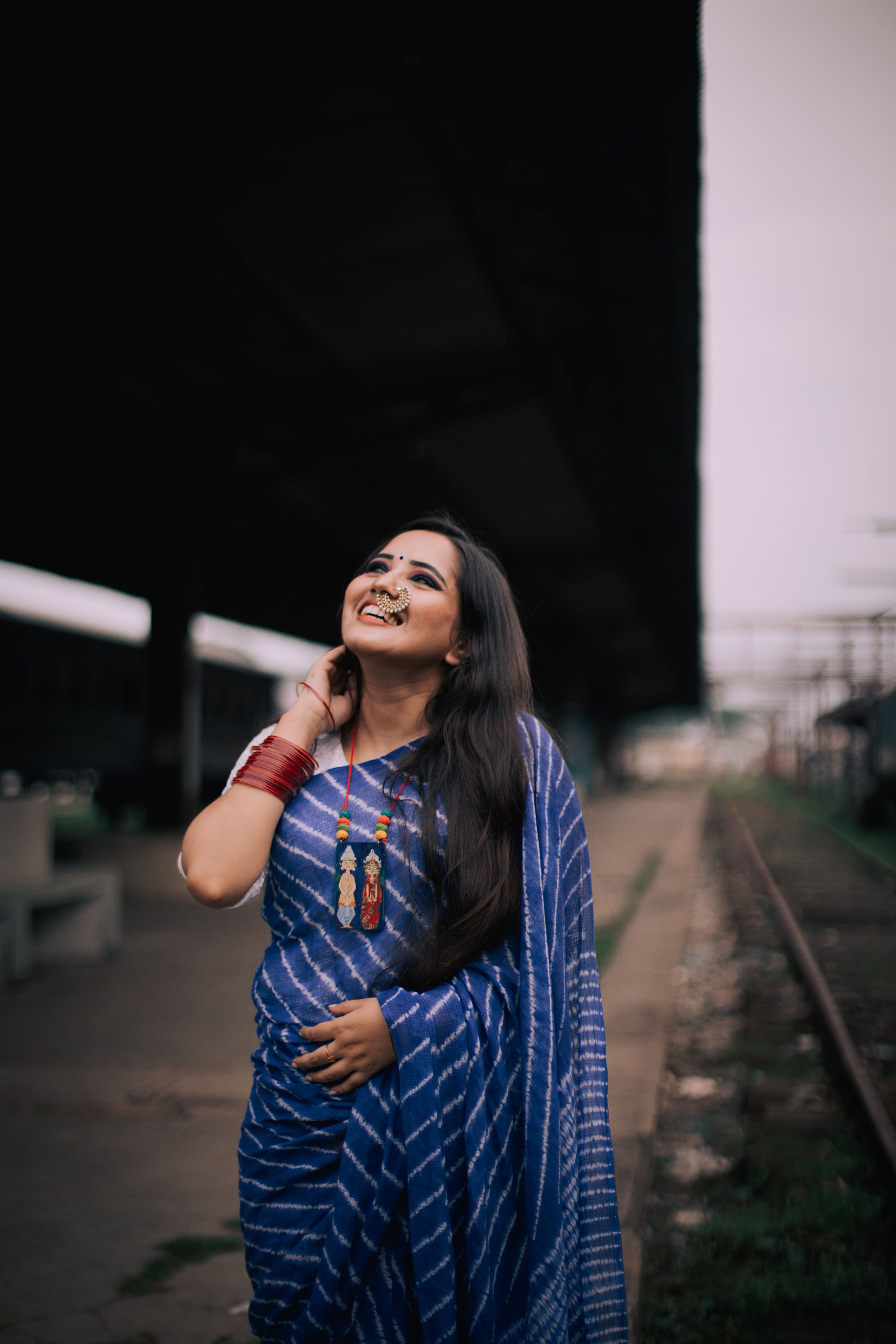 Traditional Bengali Woman in Blue Saree Outdoors · Free Stock Photo