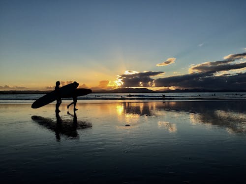 Gratis stockfoto met lange planken, strand zonsondergang, zonsondergang