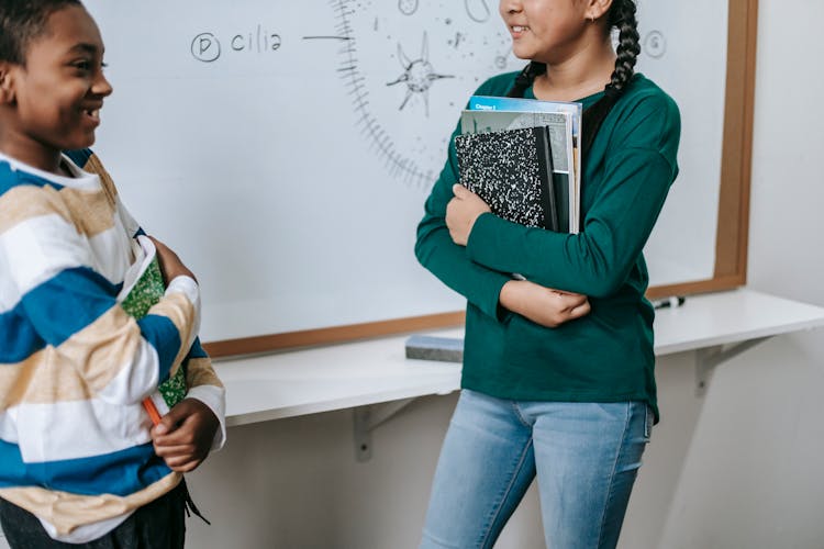 Crop Positive Little Multiracial Classmates Standing Near Whiteboard At School