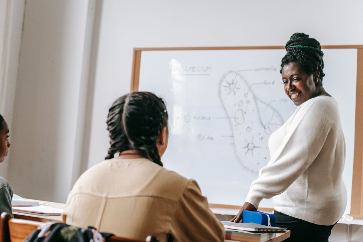 Teacher guiding learners in class