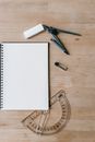 Notepad and school supplies on table