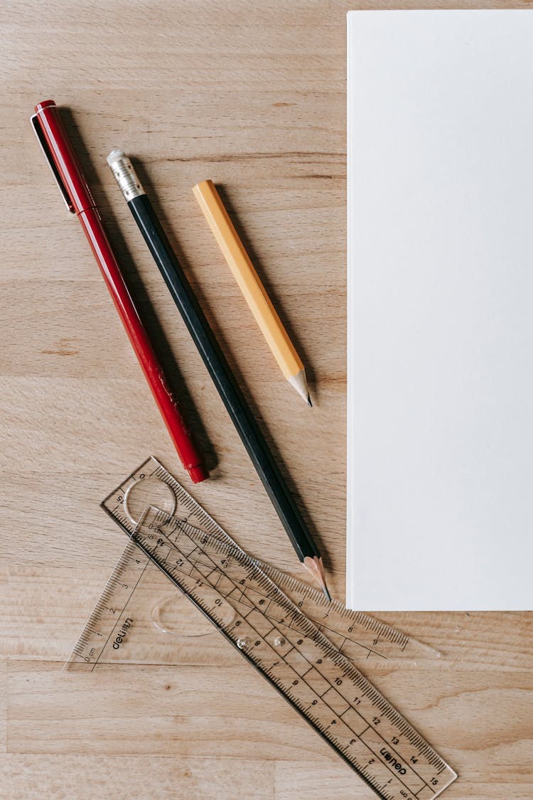 Pencils And Rulers Near Sheet Of Paper