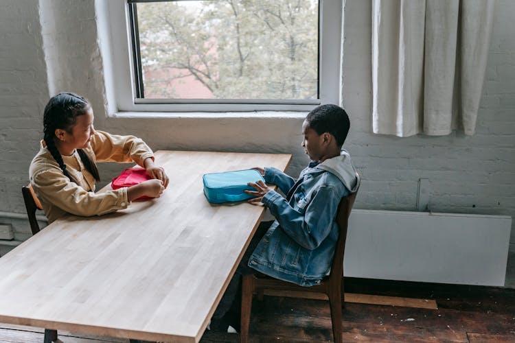 Multiracial Schoolchildren Having Breakfast During Break