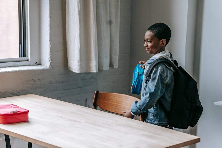 Black Schoolboy With Backpack And Lunch Box