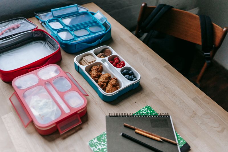 fridge shelf lined with prepped lunch containers
