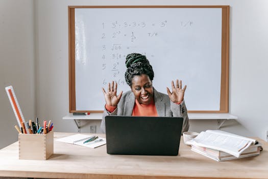 Smiling teacher enjoying an online math class with equations on whiteboard.