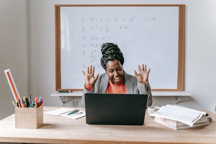 Happy Black Woman Using Laptop For Online Work