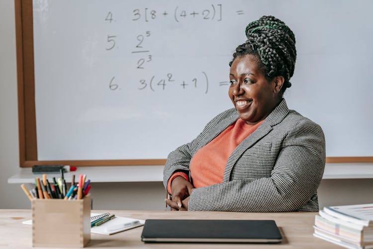 Cheerful Solid Black Woman Expecting For Lesson