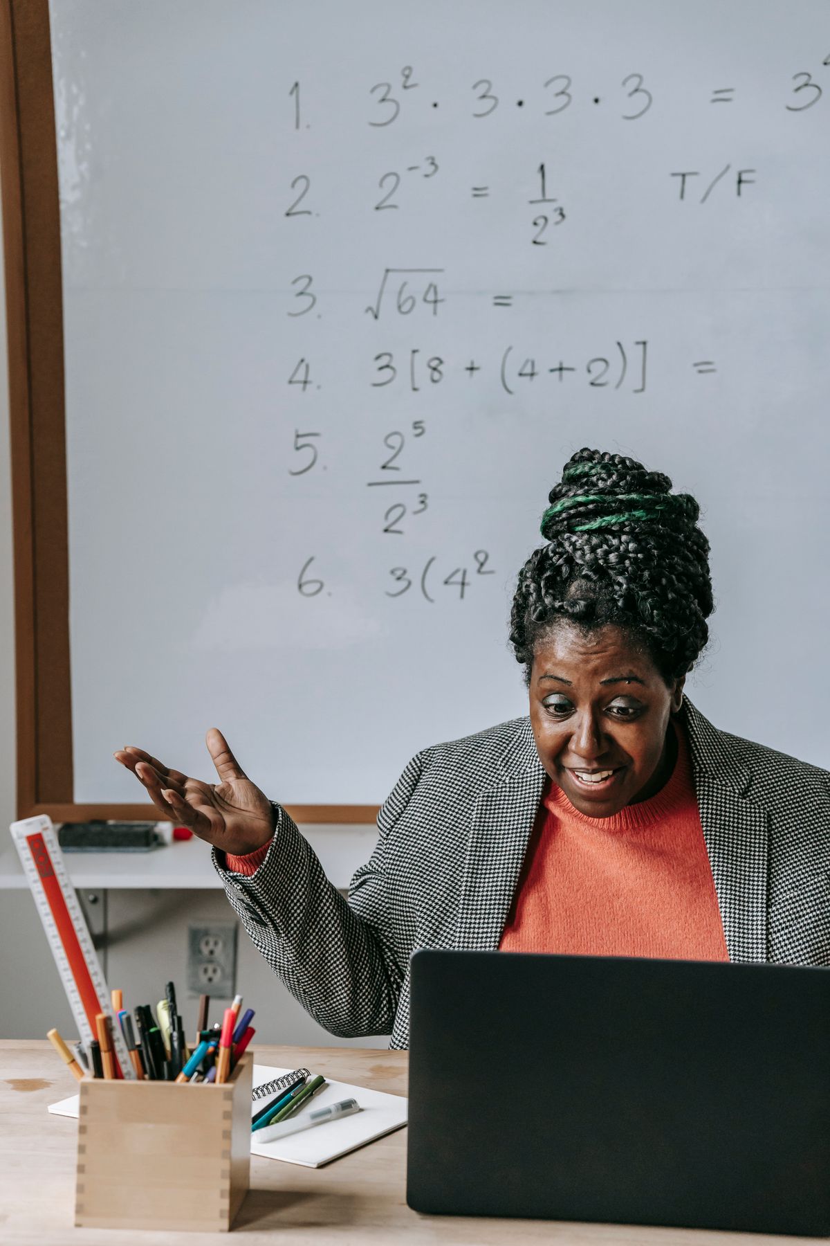 Course creator teaching with a whiteboard
