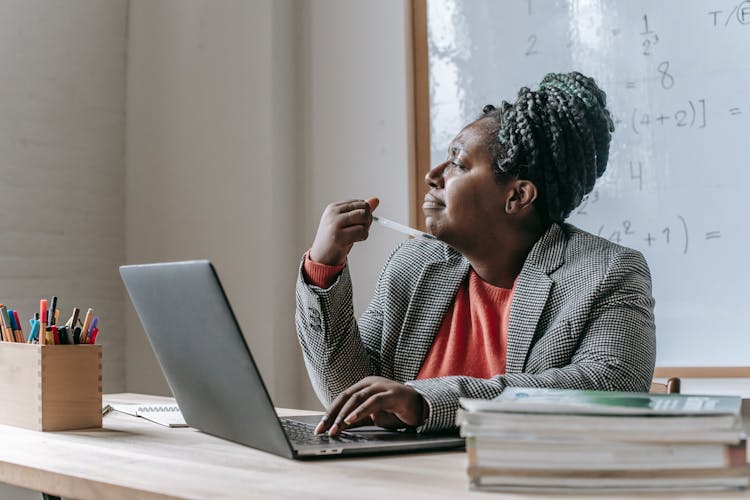 Pensive Black Woman In Classroom