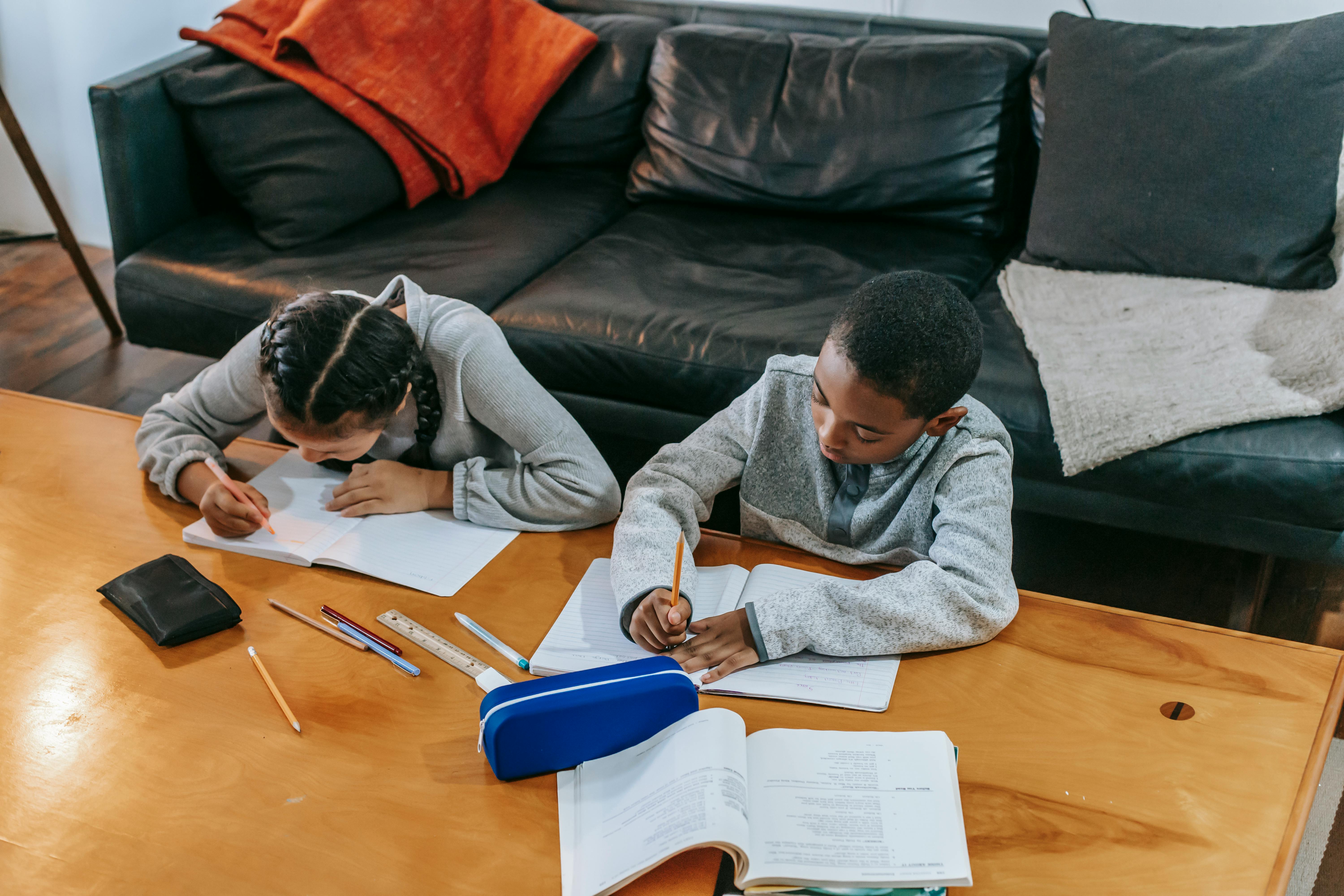 focused children doing tasks at home