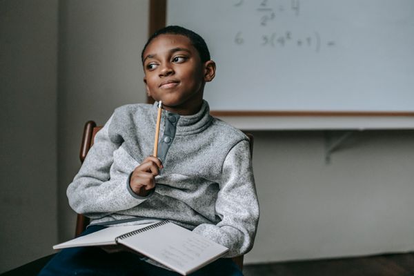 A student working through math in class