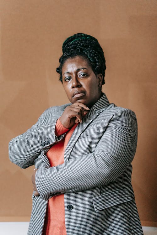 Confident black woman in formal clothes