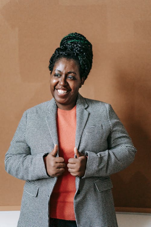 Free Smiling black professor in elegant jacket Stock Photo