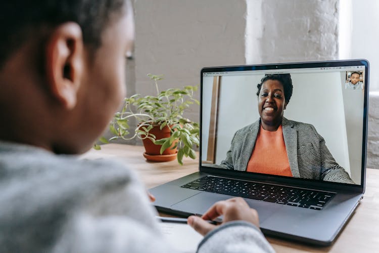 Crop Black Pupil Studying At Home With Laptop During Quarantine