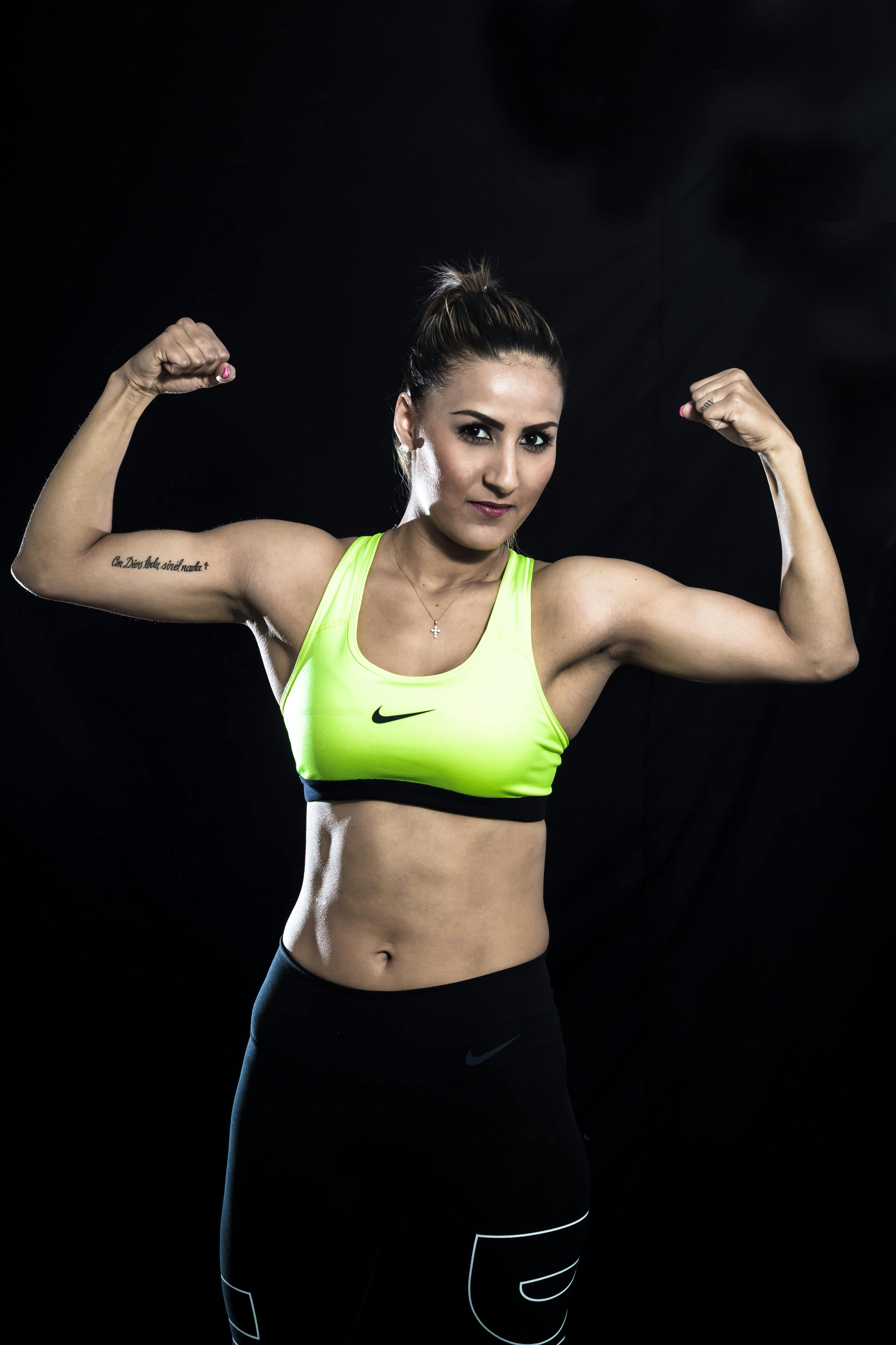 woman in green sports bra and black shorts