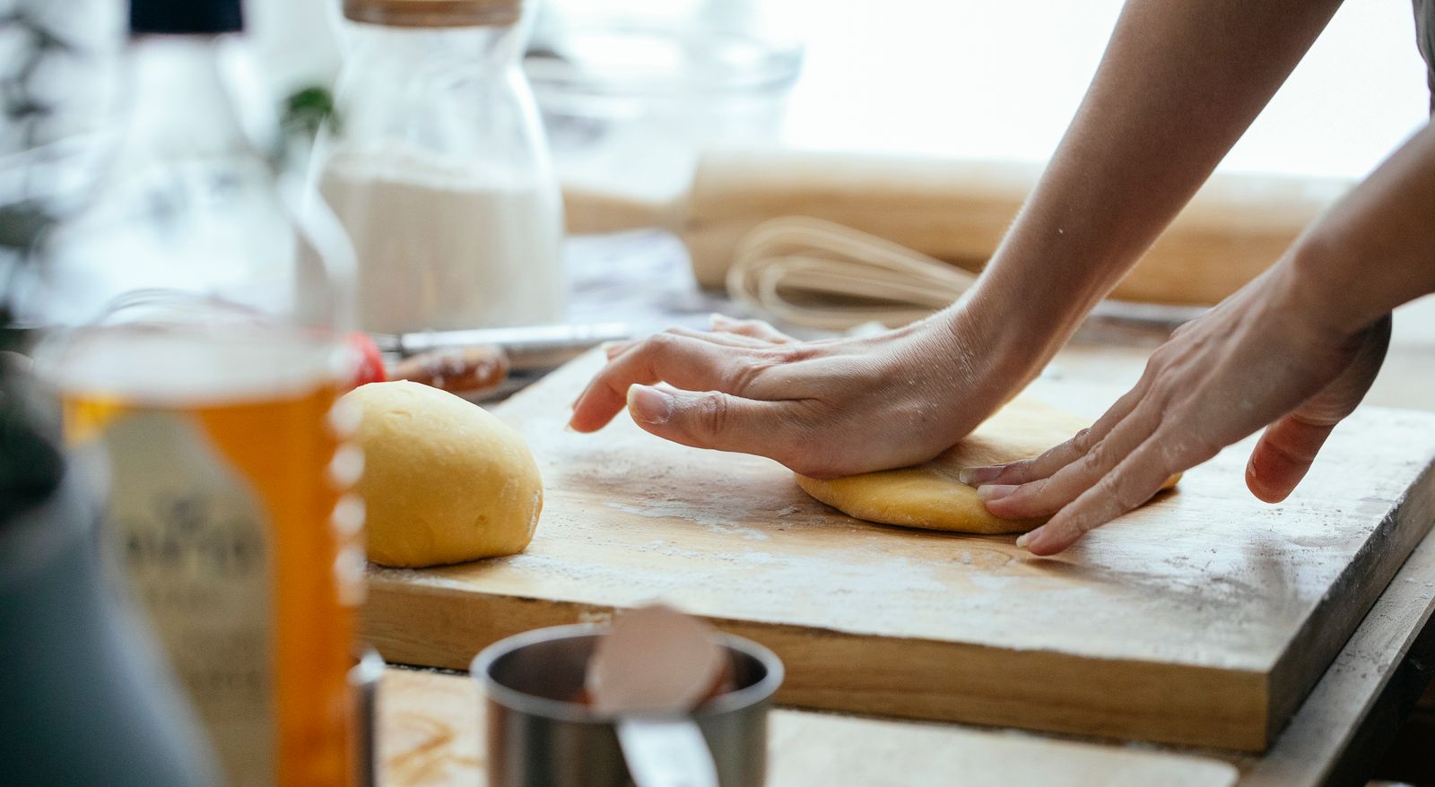 Kneading bread dough on a wooden counter