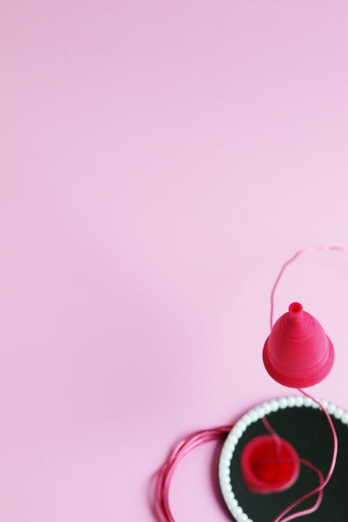 Menstrual Cup on Pink Background