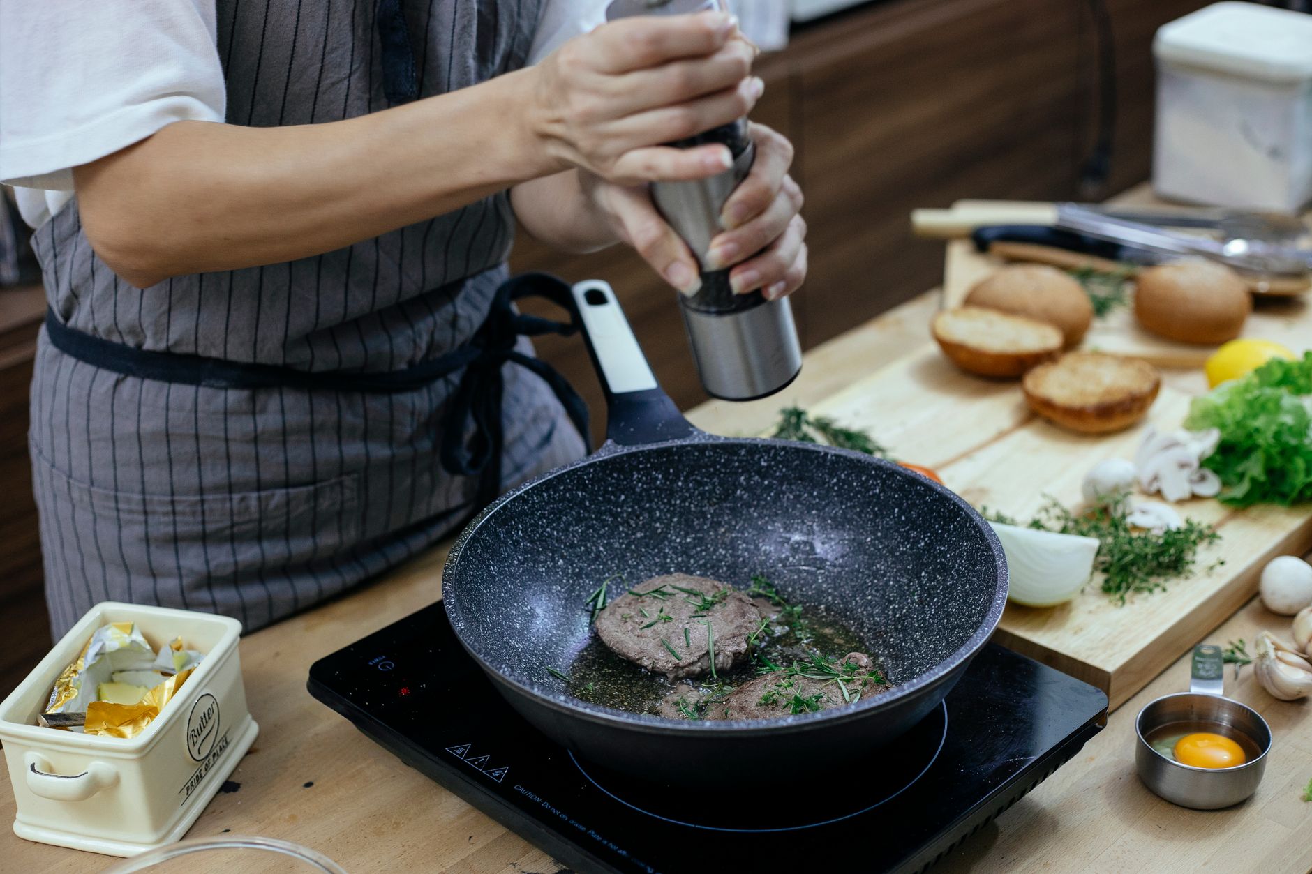 Electric salt and pepper grinders on kitchen counter