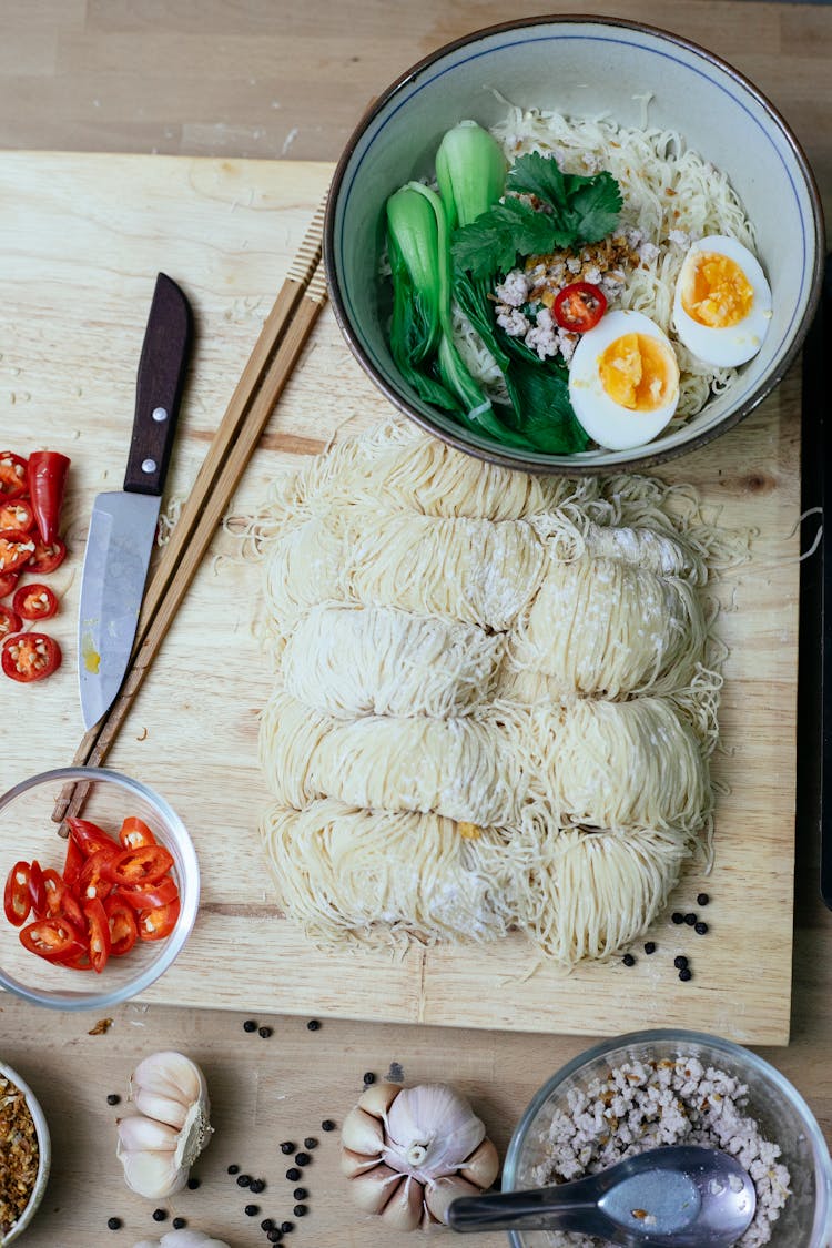 Ramen With Raw Pasta On Table