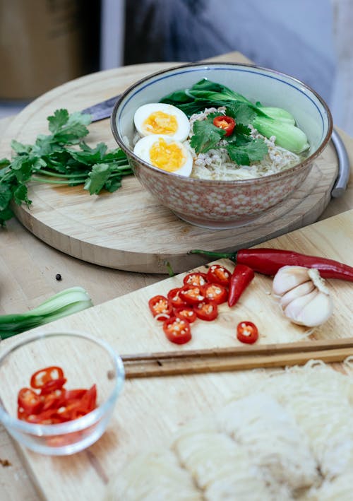 Free Bowl with ramen on table near pepper Stock Photo