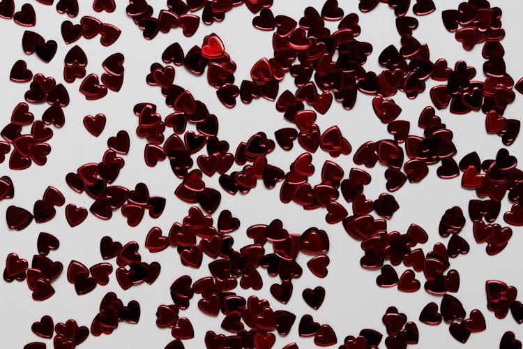 Red Heart Shaped Decors On White Surface