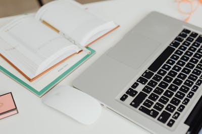 Laptop and calendar on desk workspace