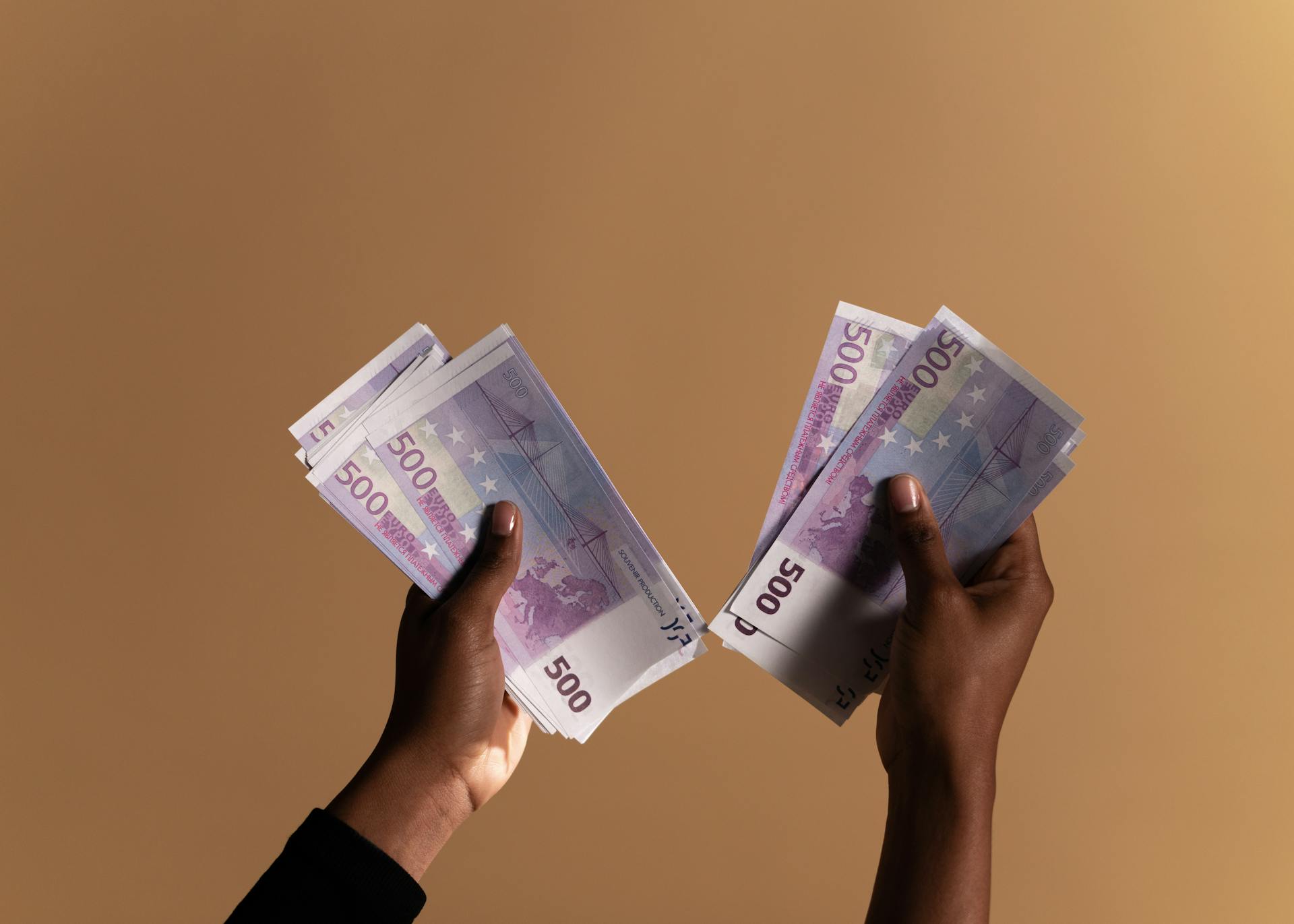 Person Holding Banknotes