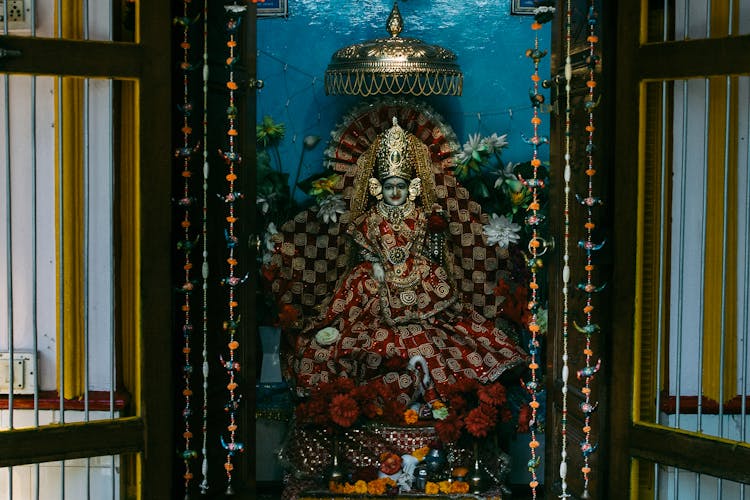 Traditional Statue Of Indian God On Throne