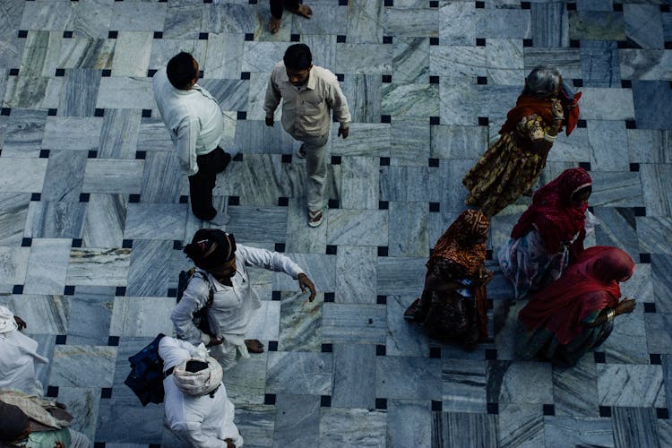 Top View Of Ethnic People Walking On Street