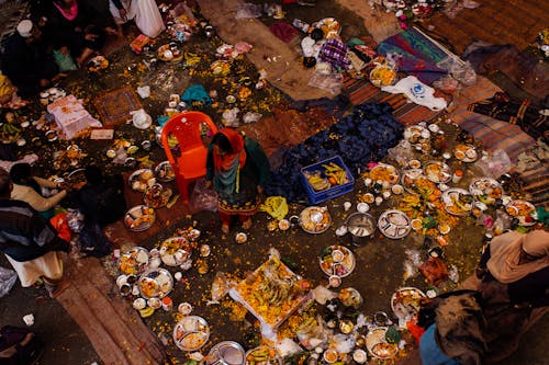 Poor Indian people with food on plates