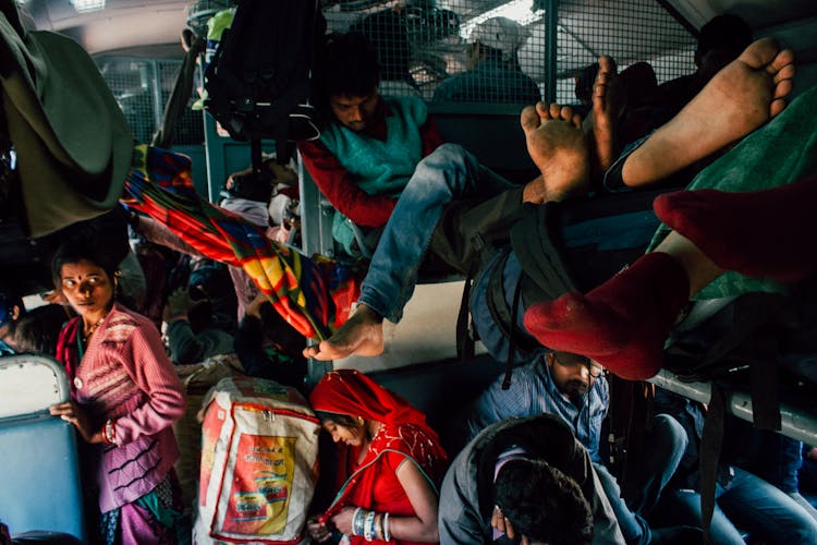 Crowded Bus With People And Baggage