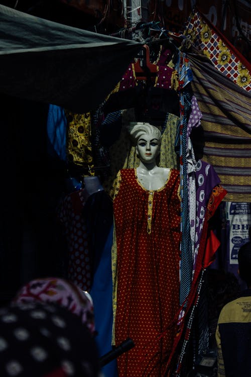 Mannequin dressed in long clothes in market