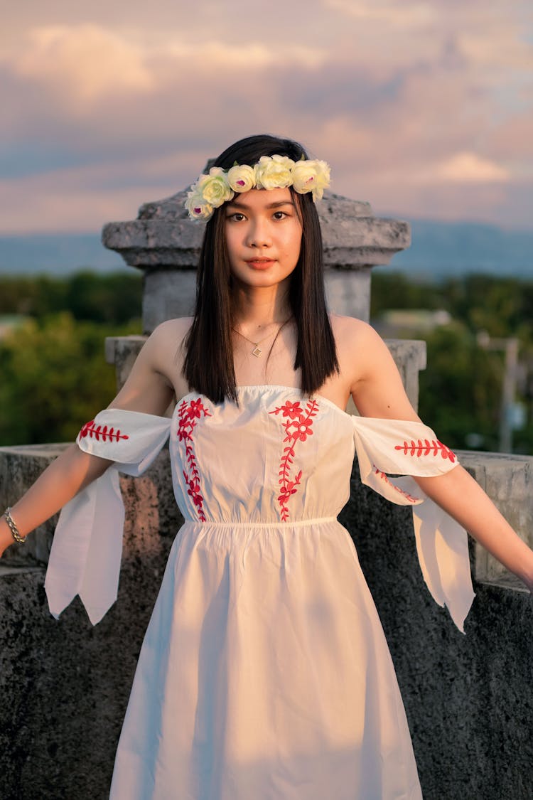 Woman Wearing White Dress And Flower Headpiece