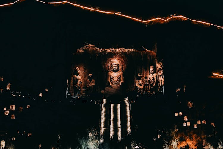 Ancient Buddha Statues In Dark 