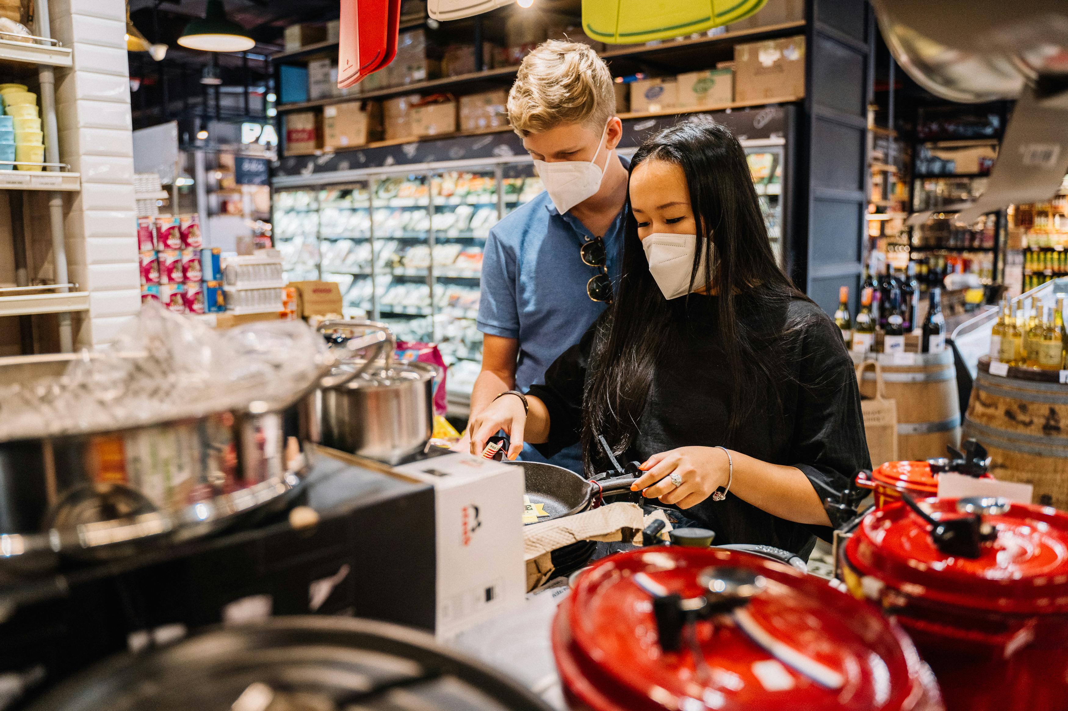 couple looking at kitchenwares inside a store