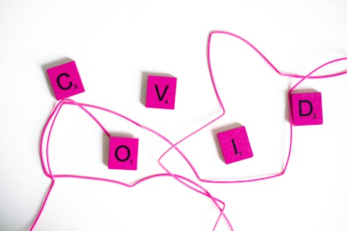 Pink Scrabble Tiles on White Background