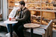 Young couple having rest in small cafeteria