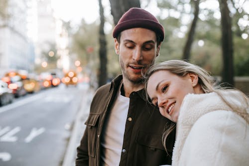 Smiling couple having romantic date on city street
