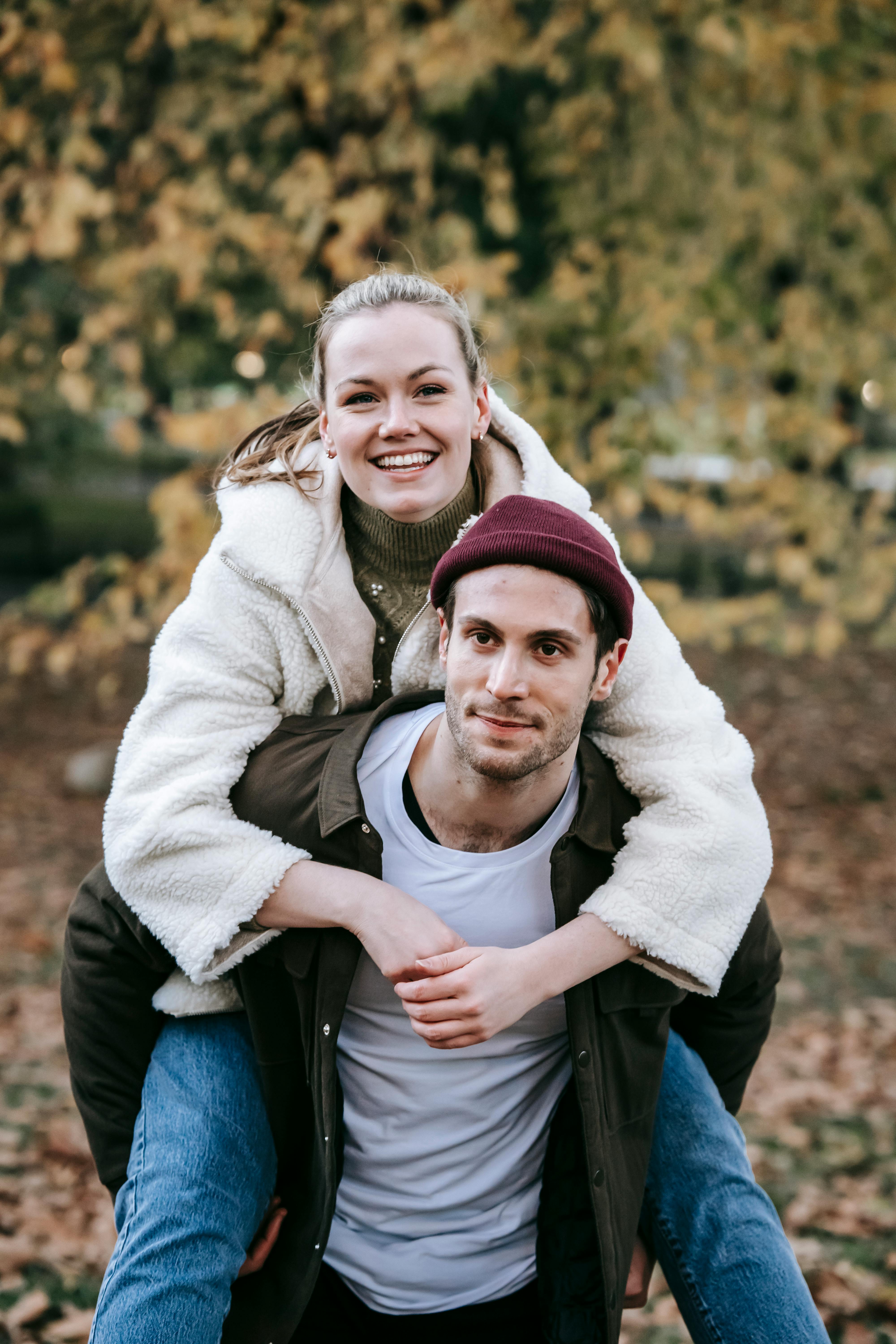 Couple in love girlfriend riding on back of boyfriend at park,Romantic and  enjoying in moment of happiness time,Happy and smiling Photos | Adobe Stock
