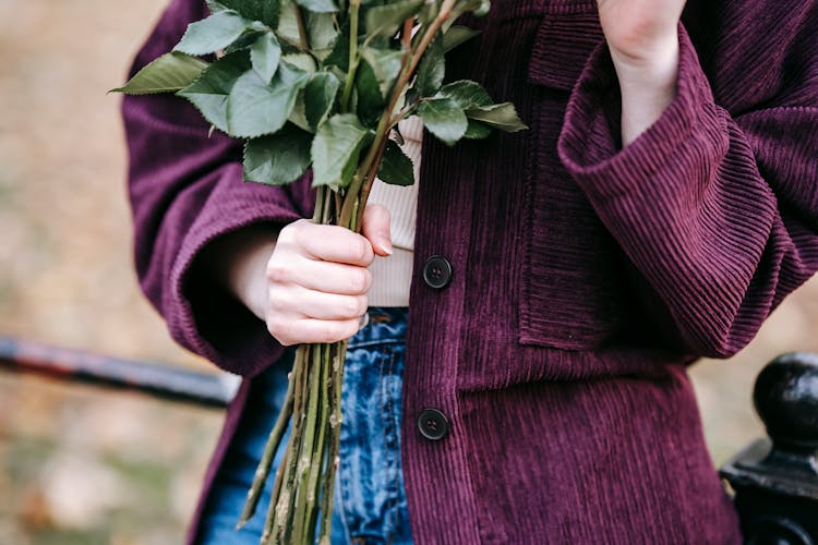 Unrecognizable Woman With Bunch Of Flowers