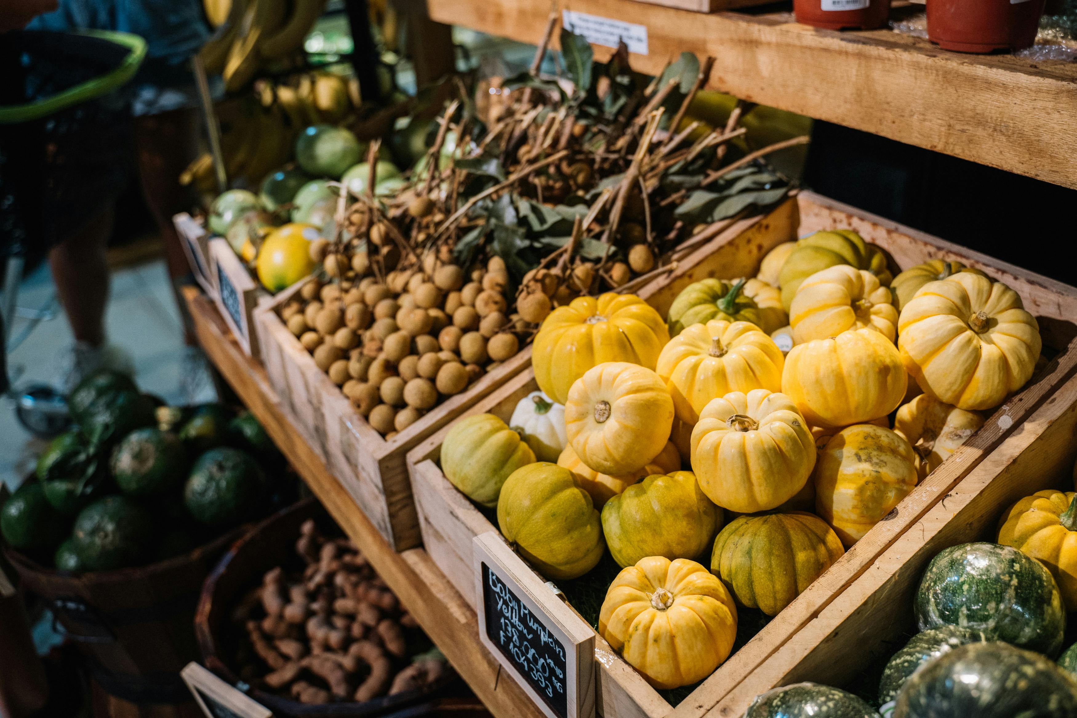 yellow and green squash on brown wooden crate