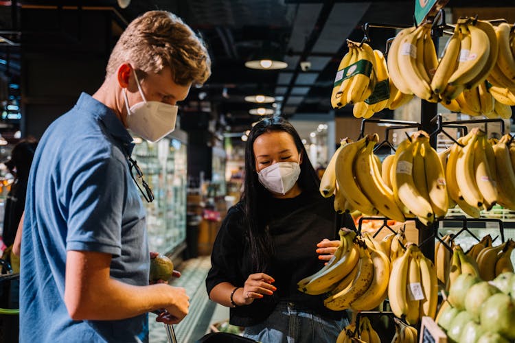 Couple Looking At Fresh Food Inside A Market