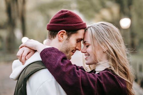 Free Loving couple embracing in park Stock Photo