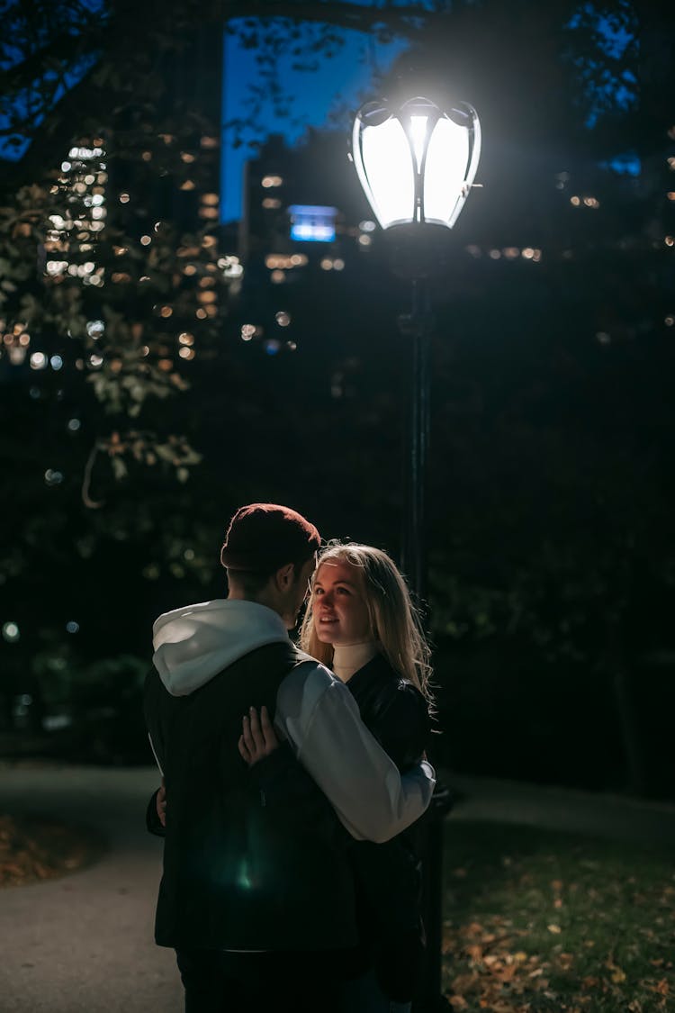 Romantic Couple Hugging In Park At Night