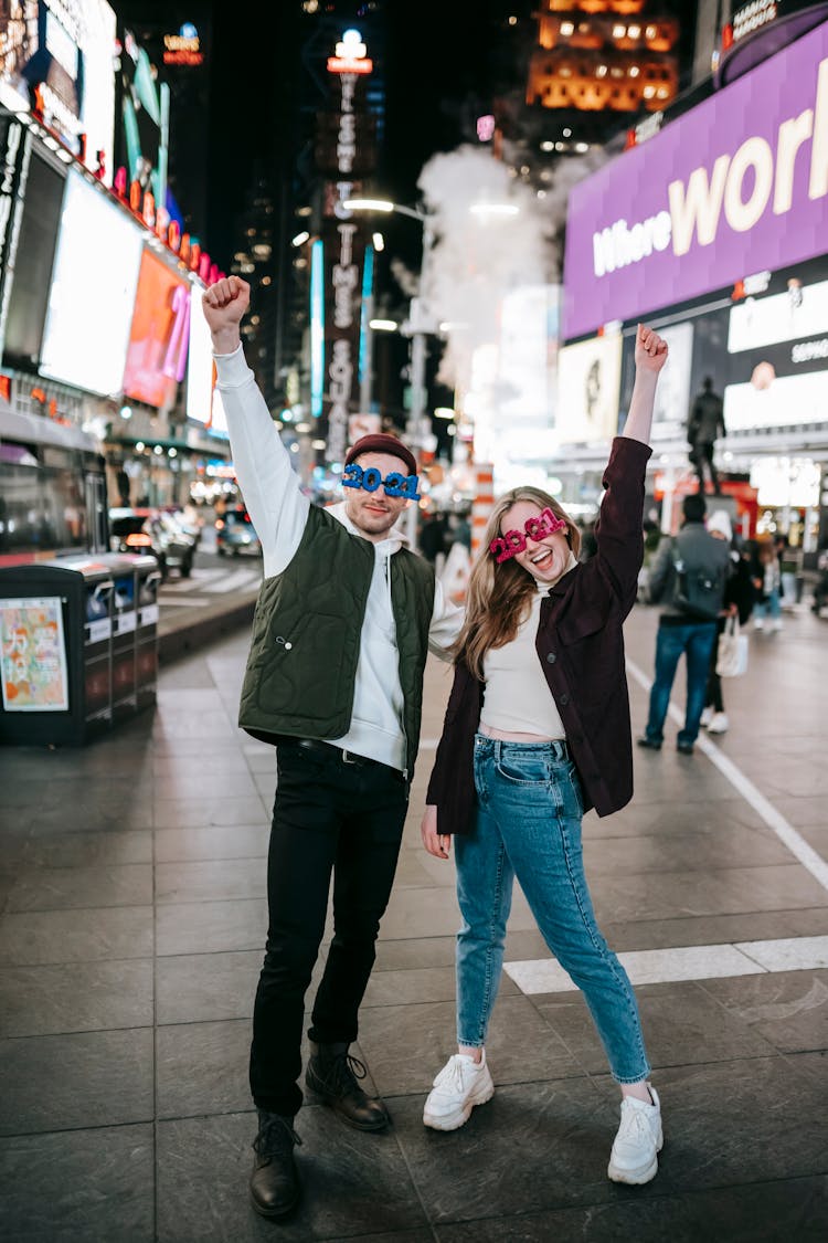 Cheerful Couple Wearing Trendy Glasses Standing On Square