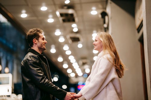 Smiling couple standing in hall of subway