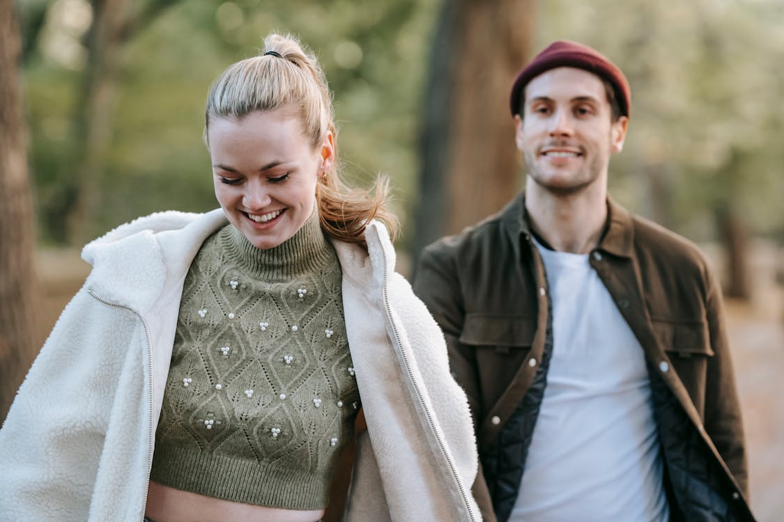 Free Positive couple walking in park Stock Photo
