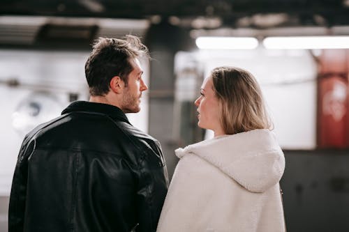 Free Young couple standing together in metro Stock Photo