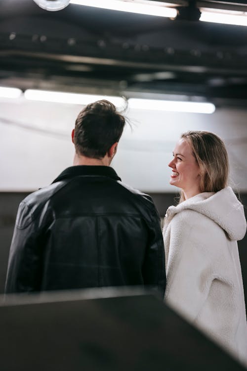 Free Happy couple talking in underground station Stock Photo